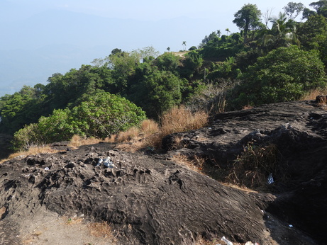 Mullanpara rock outcrop at Vayalada, overlooking the hazy valley